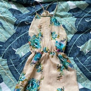 Floral halter dress with peek a boo back slit